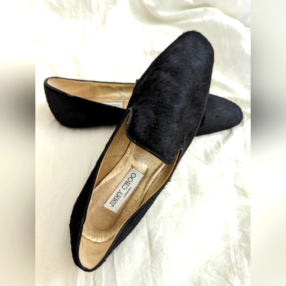 Jimmy Choo black calf hair flats.